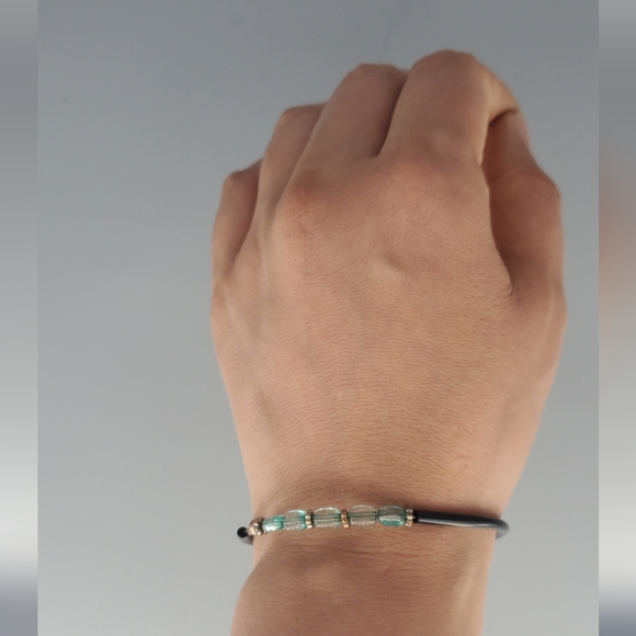 Spiral Green Goldtone Earrings and Cross Black And Green Bracelet - Picture 10 of 12